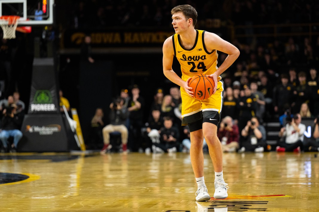 Iowa Hawkeyes forward Pryce Sandfort (24) looks to pass during the second half against the Wisconsin Badgers at Carver-Hawkeye Arena on February 8, 2025