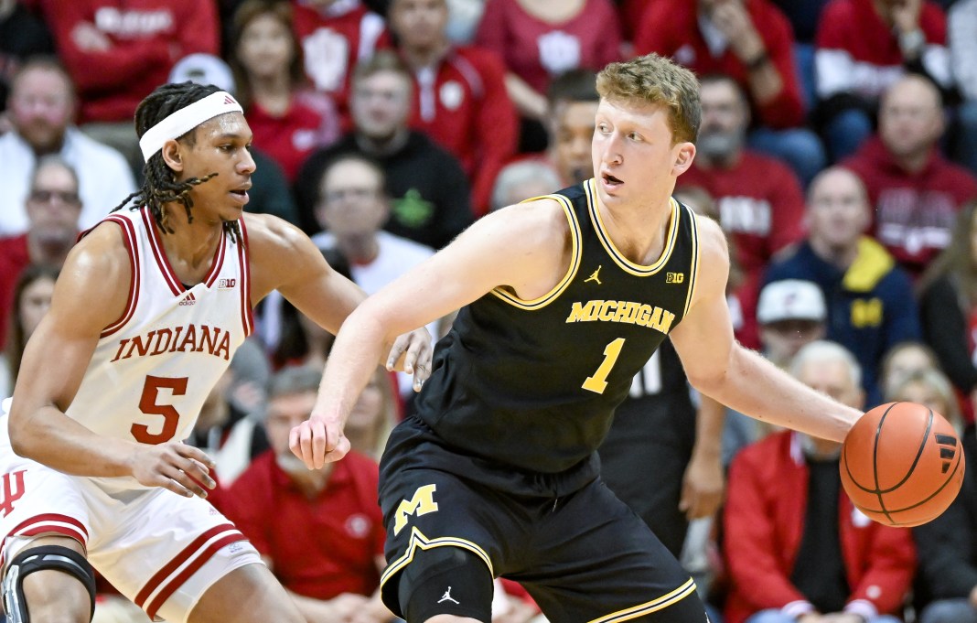 Michigan Wolverines center Danny Wolf (1) drives to the basket against Indiana Hoosiers forward Malik Reneau (5) during the first half at Simon Skjodt Assembly Hall on February 8, 2025