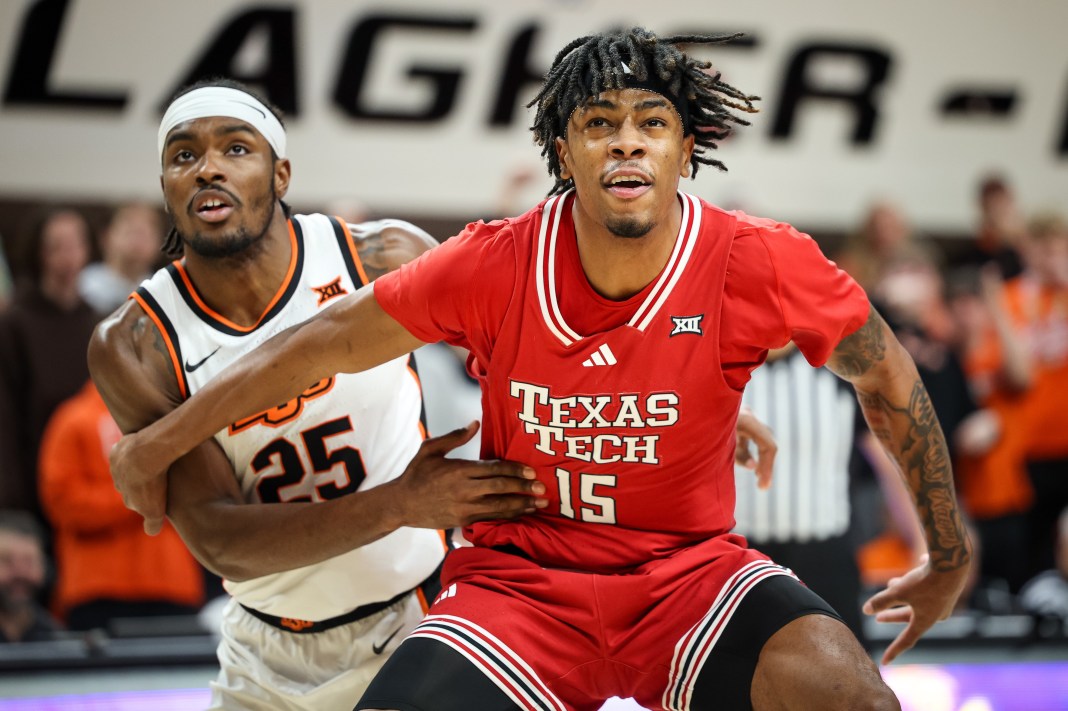 Texas Tech Red Raiders forward JT Toppin (15) blocks out Oklahoma State Cowboys forward Robert Jennings II (25) during the first half at Gallagher-Iba Arena on February 15, 2025.